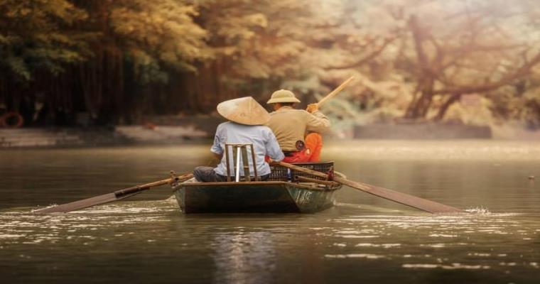 traditional boat tour on the ngo dong river in tam coc ninh binh vietnam