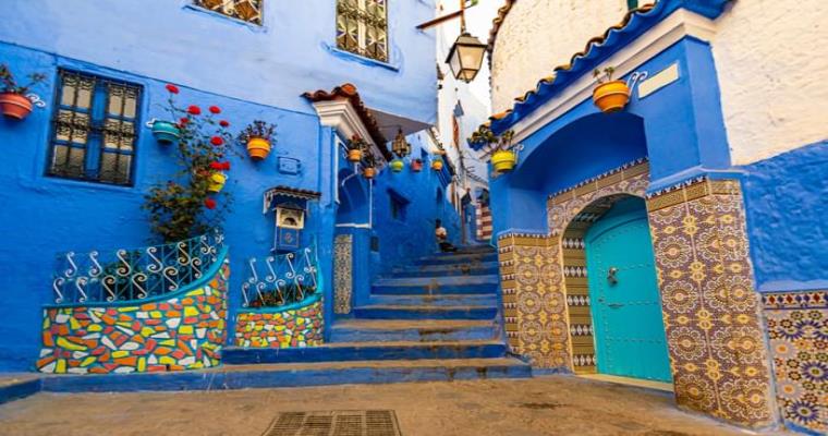 a vibrant blue alley in chefchaouen morocco   a day trip from marrakech